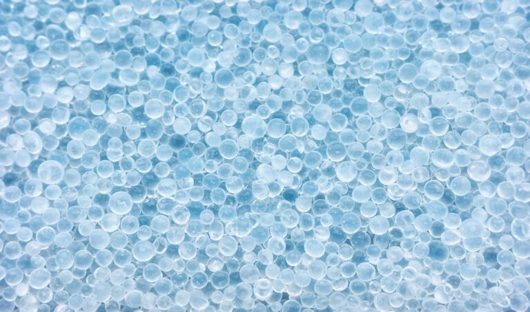 Closeup photo of silica gel beads, selective focus.